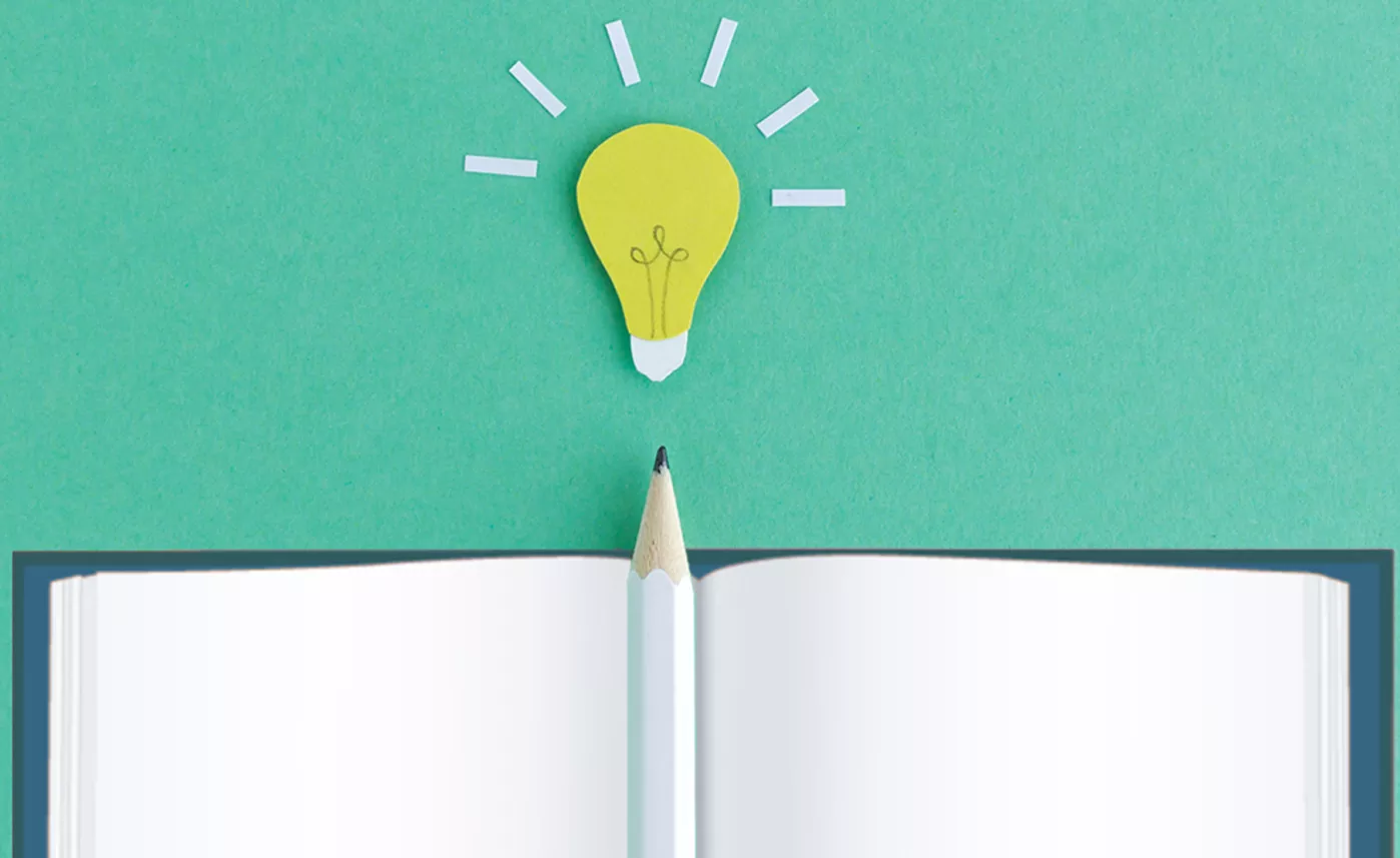  A graphic showing an open notebook, a pencil, and a lightbulb "idea".
