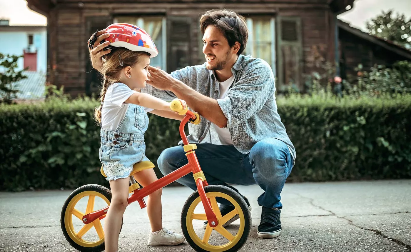  Man with child on a bike
