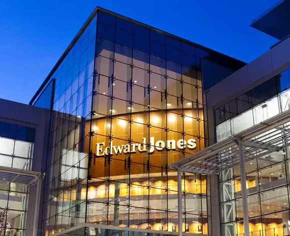  The front of the Edward Jones headquarters, lit up at night.
