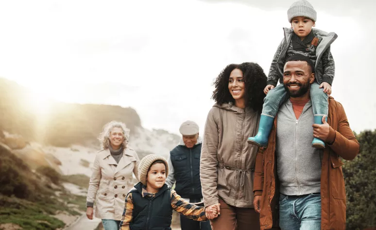 Happy family hiking together in scenic mountains at sunset Happy family hiking together in scenic mountains at sunset