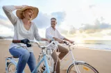 Two Edward Jones clients ride bikes and enjoy retirement with clear direction for their financial future.