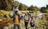 A family enjoys time outdoors together.