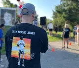 A volunteer capturing a photo of the event.